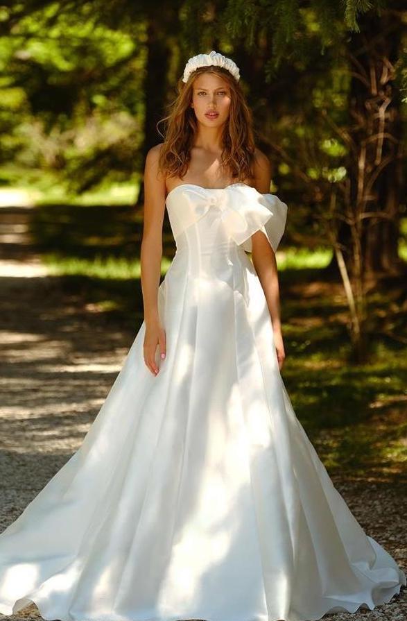 Model in Ange Etoiles strapless ballgown wedding dress